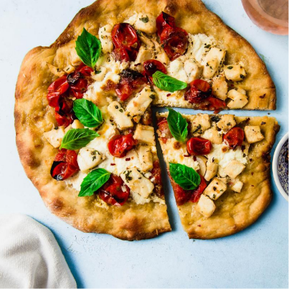 Roasted Cherry Tomato and Garlic Pizza with Herbed Halibut | Alaska Gold Seafood