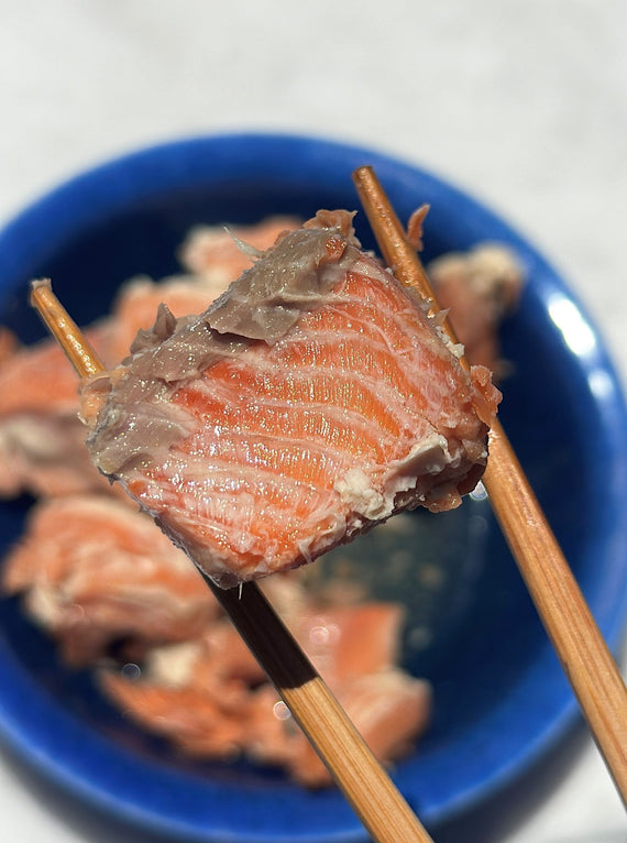Canned coho salmon in chopsticks