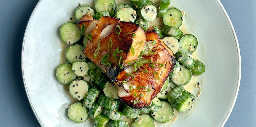 Plate with miso-glazed black cod and cucumbers
