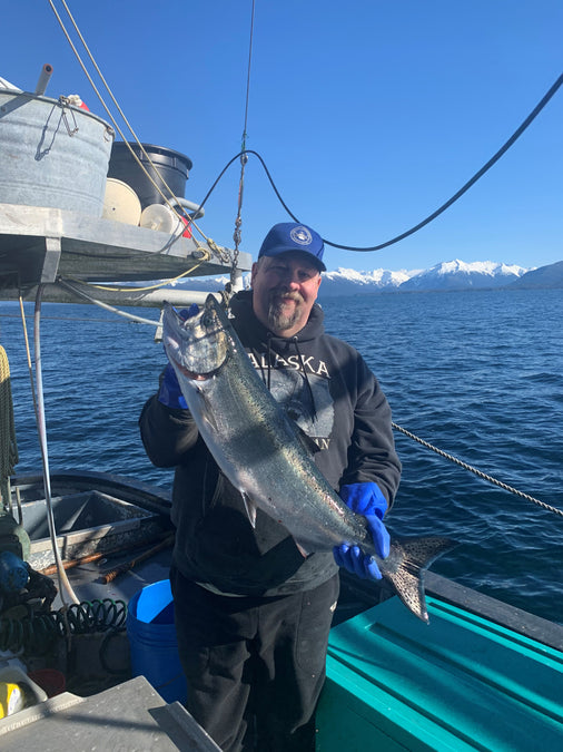 fisherman with king salmon