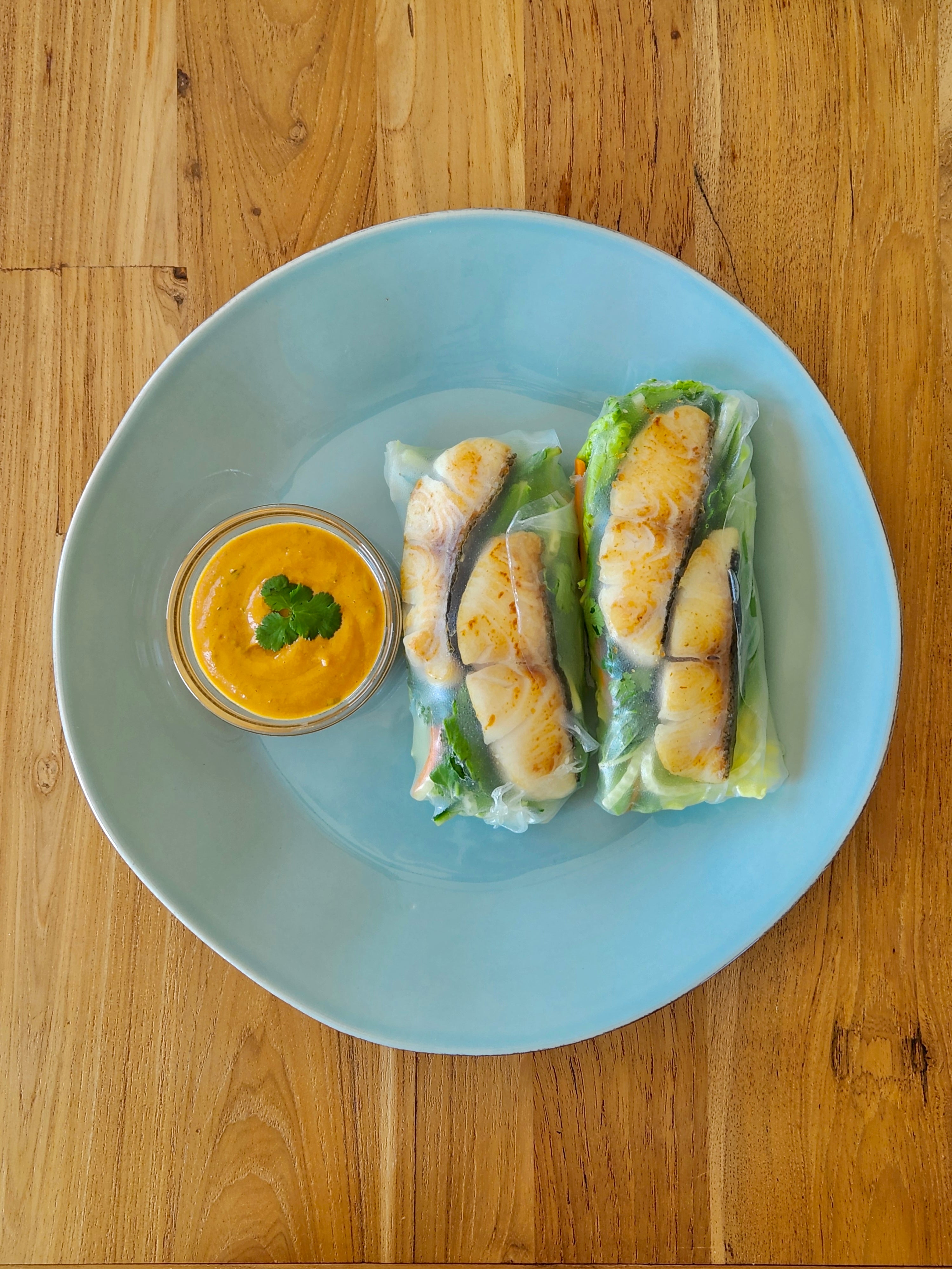 black cod spring rolls on a plate
