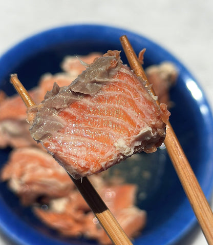 Canned coho salmon in chopsticks