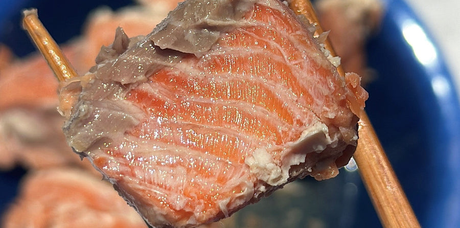 Canned coho salmon in chopsticks