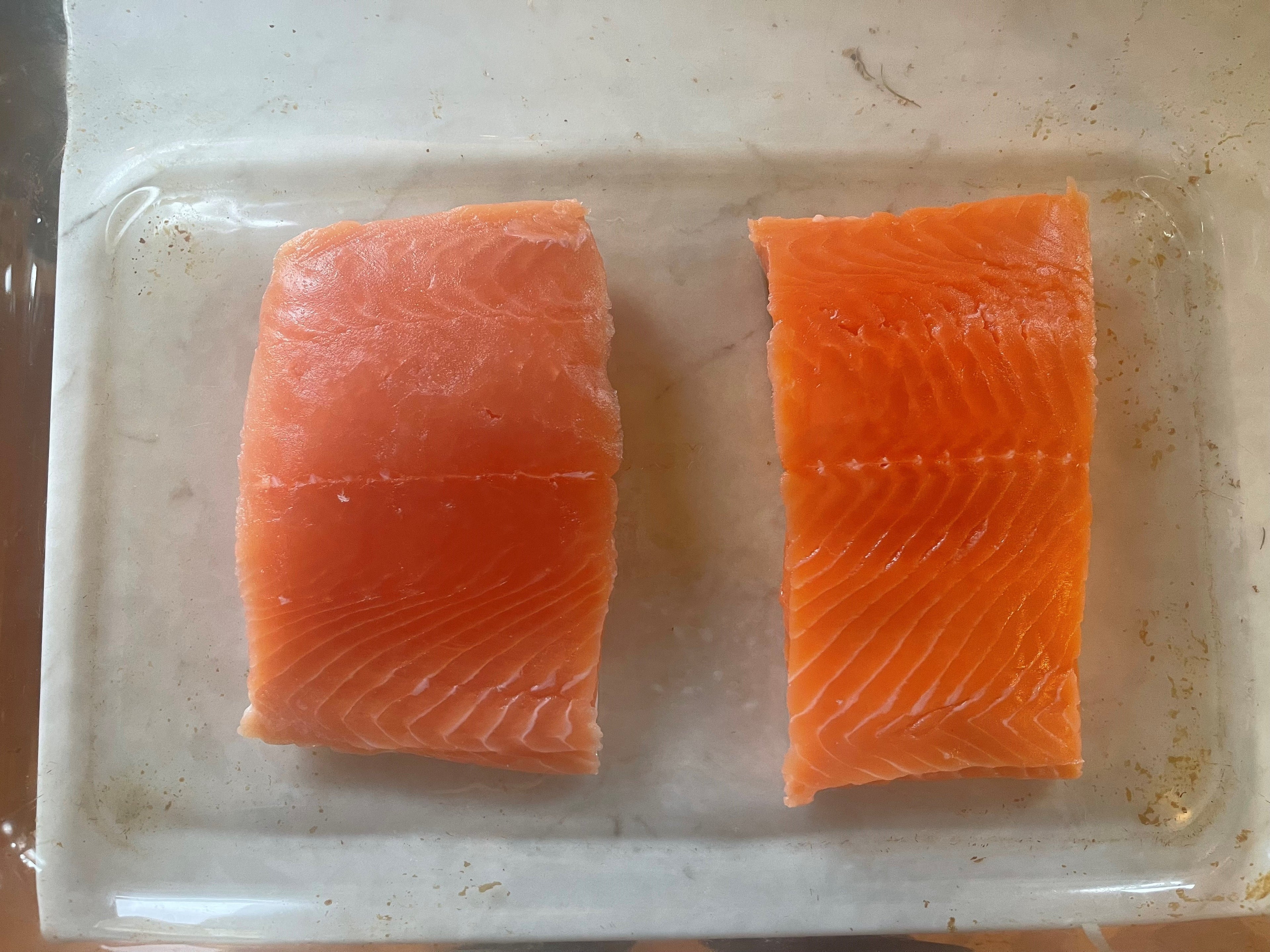 Keta salmon fillet on left and coho salmon fillet on right