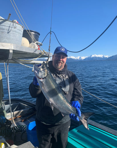 fisherman with king salmon