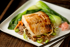 miso-marinated sablefish on plate of greens and vegetables